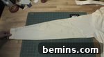 The arm of a shirt, which is laid out to be worked on.