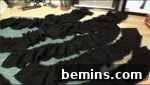 Several pieces of tattered black cloth, showcasing the raw and edgy look of the ruffles.