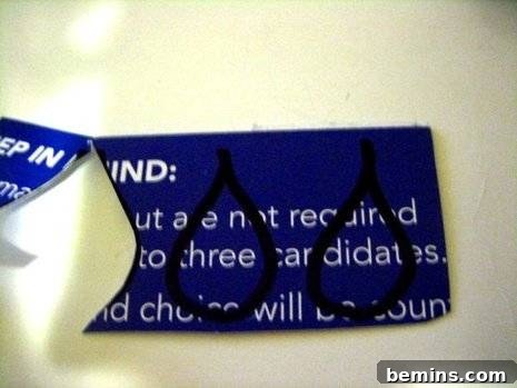 Turning Trash into Treasure: Junk Mail Art 3 A blue tag that has been ripped in half, showcasing the texture and potential for reuse.