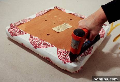 Finished seat cushion being pulled over
