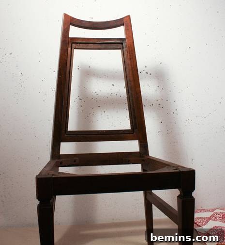 Stripping old fabric from the chair