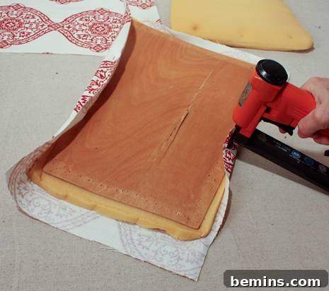 Securing fabric with staples
