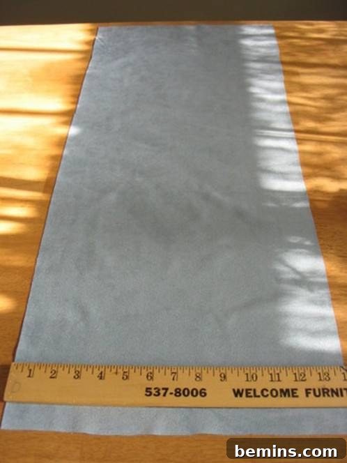 A ruler measuring a piece of fabric 14 inches in width.