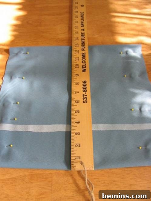 A wooden ruler is sitting on a blue towel.