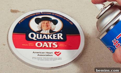Repurpose and Organize: An Oatmeal Container Ribbon Dispenser 17 Gluing Fabric to the Top