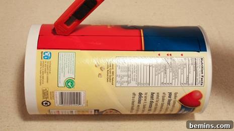 Repurpose and Organize: An Oatmeal Container Ribbon Dispenser 4 Cutting the Ribbon Slot