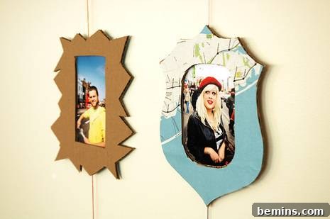 Two picture frames that have odd jagged edges frame two pictures, one of male and one of female.