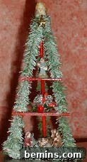 A Christmas tree decorated with dolls, representing Ukrainian Christmas traditions.