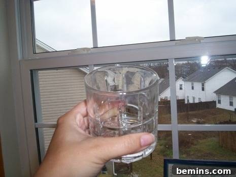 Cleaning Cloudy Glassware: Restoring Shine and Clarity 4 Clean drinking glass after removing hard water stains with toothpaste