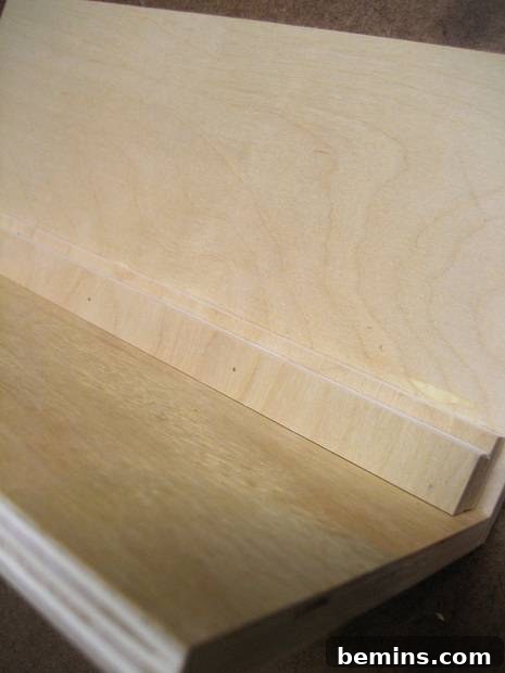 How to Craft Your Own Box Joint Jig at Home 4 The L-shaped structure of the box joint jig, with the 1-inch support strip attached to the back, providing added stability.