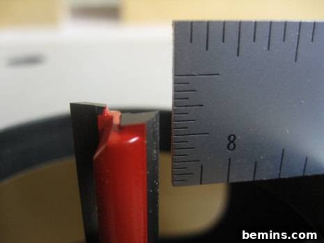 How to Craft Your Own Box Joint Jig at Home 6 A close-up of the 3/8' router bit, precisely set to the correct height for creating accurate box joints.