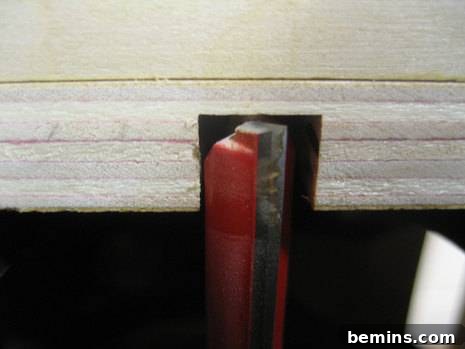 How to Craft Your Own Box Joint Jig at Home 7 The initial slot cut into the jig, establishing the baseline for creating perfectly spaced fingers.