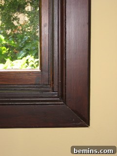 Close-up of wood picture frame corner on a wall