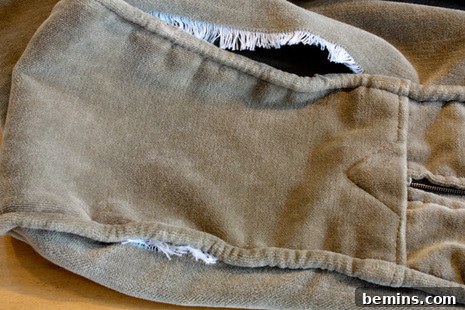 Slipcover with a torn seam before repair