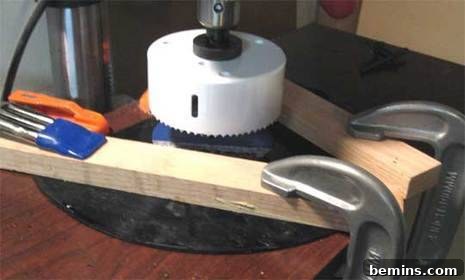 A contraction is held up with wood and tools.