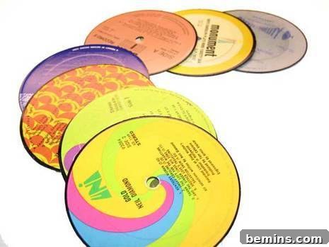 An array of colorful laser discs ataggered on top of each other.