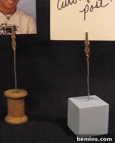 Two homemade picture holders: one wooden spool, one wooden block