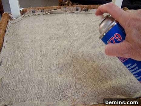 Spraying adhesive on the burlap