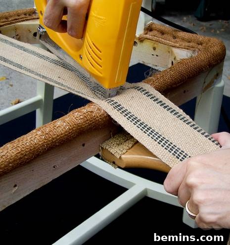 Securing the webbing with staples