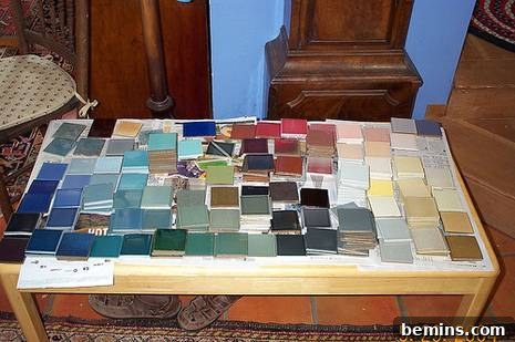 An assortment of different types of tiles displayed on a table.