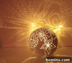 Close-up of a Moonstruck light projecting floral patterns onto a wall.