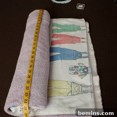 Turn Old Towels into a Cozy Body Pillow 4 Rolling up old towels