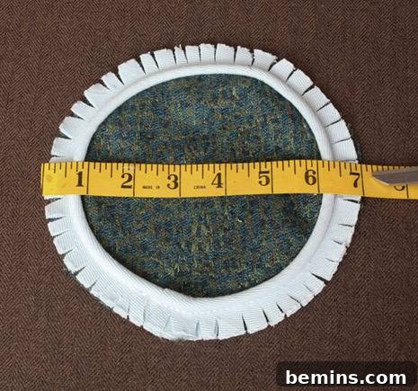 Turn Old Towels into a Cozy Body Pillow 9 Stitching cording around the fabric circles