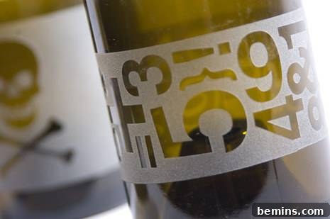 Sanding the Edge of a Cut Wine Bottle