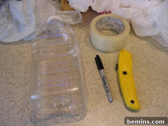 Plastic bottle, tape, marker, and box cutter for crafting a plastic bag organizer
