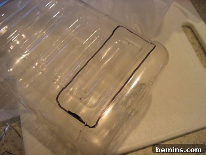 Rectangle box marked on a plastic bottle, indicating the cut-out area