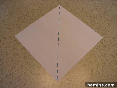 Fold paper diagonally into a triangle