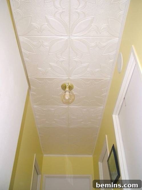 The ceiling in a yellow hall is white.