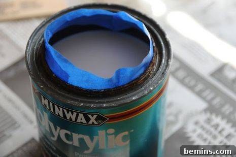 Painter's Tape on the Rim of a Rusty Paint Can