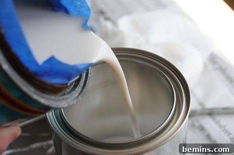 Pouring Polyurethane into a New Paint Can