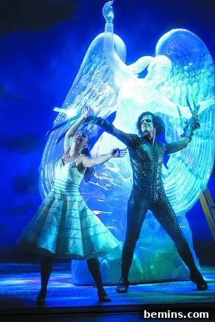 People are acting on stage with a blue background.