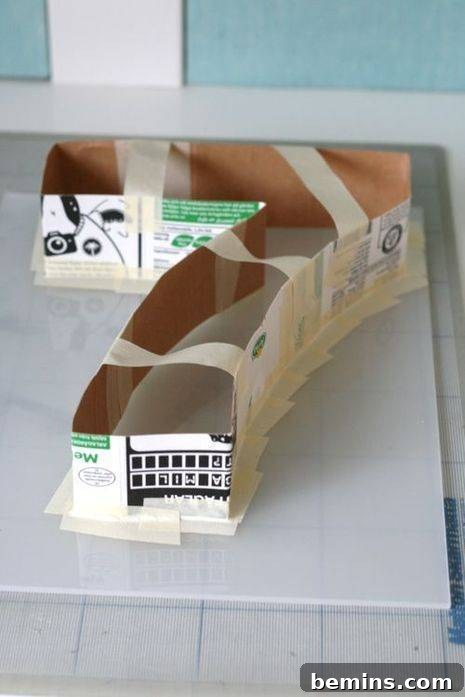 Taping the Number 7 to Secure Its Shape in the Mold