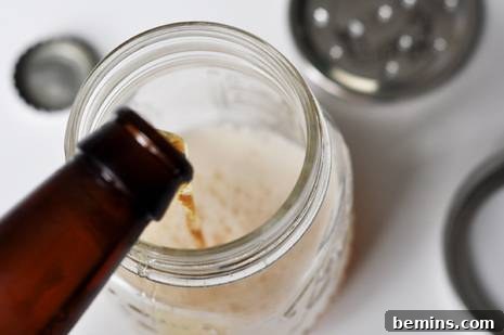 Mason Jar Fruit Fly Trap 5 Adding apple cider vinegar to fruit fly trap