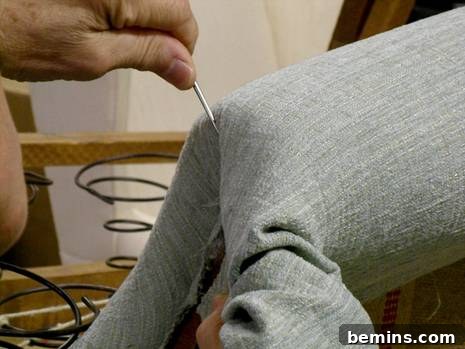 Upholstery Workshop: Mastering Pleated Rolled Arms 4 Securing the pleat with staples