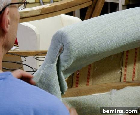 Upholstery Workshop: Mastering Pleated Rolled Arms 7 Securing the fabric around the arm