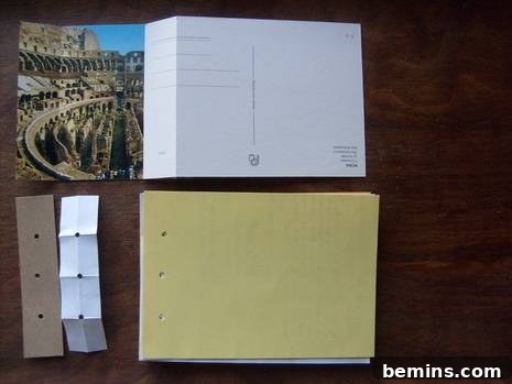 Scoring lines on a postcard spine and punching holes in a stack of paper using a DIY template