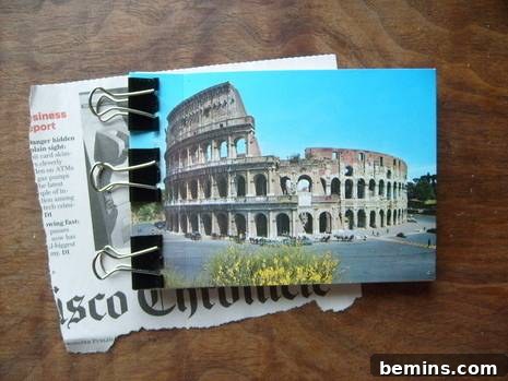 Carefully positioning the bound pages onto the glued postcard cover and clamping them together