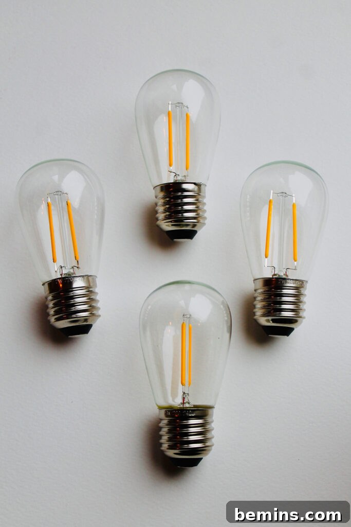 Unlock Your Light Bulbs' Potential: A Guide to Lubrication 2 Four fancy lightbulbs.