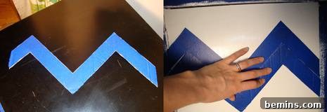Taping in between each pencil line to create the chevron pattern
