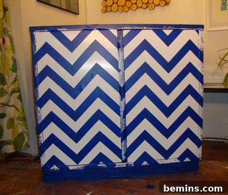 The cabinet fully taped with the chevron pattern