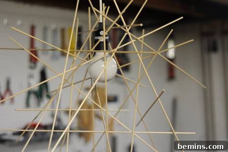 Adding more dowels at various angles to create a twig-like structure.