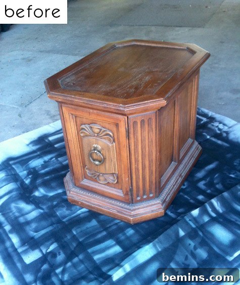 A toy chest sitting on a painted piece of white paper.