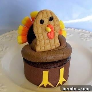 Turkey Time: 8 Delightful Thanksgiving Dishes 7 Oreo and Nutter Butter topped creation with cupcake at the bottom.