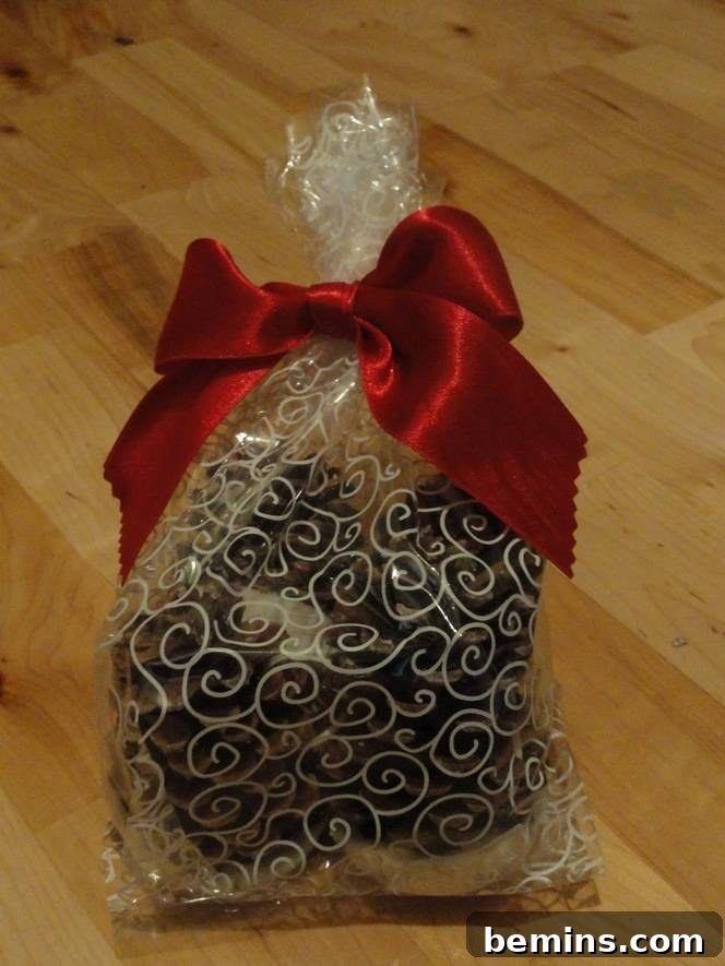 Transparent gift box tied with red ribbon.