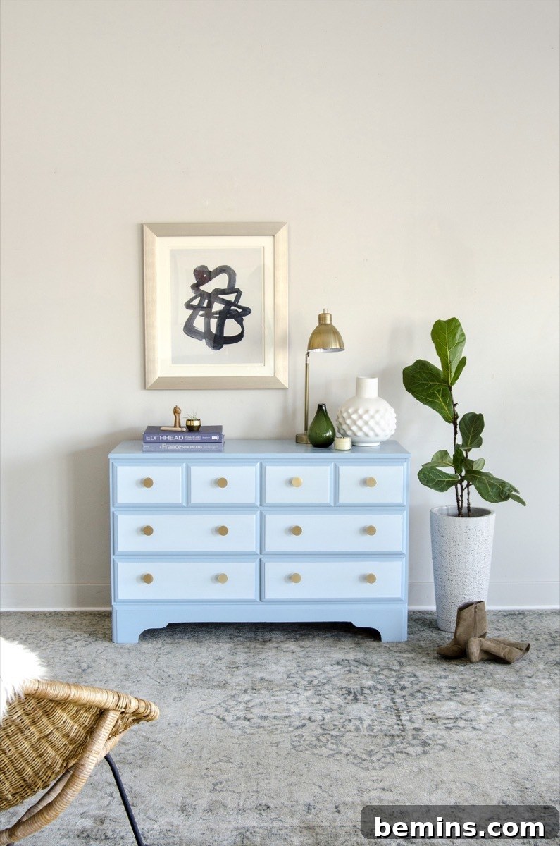 Repainted blue dresser, showcasing the final result of a dresser makeover project.