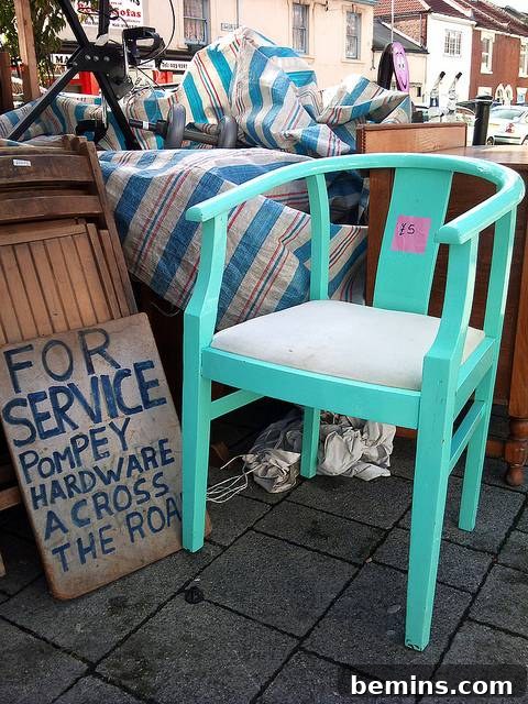 A sea castle green chair before its transformation into a whittled sculpture.